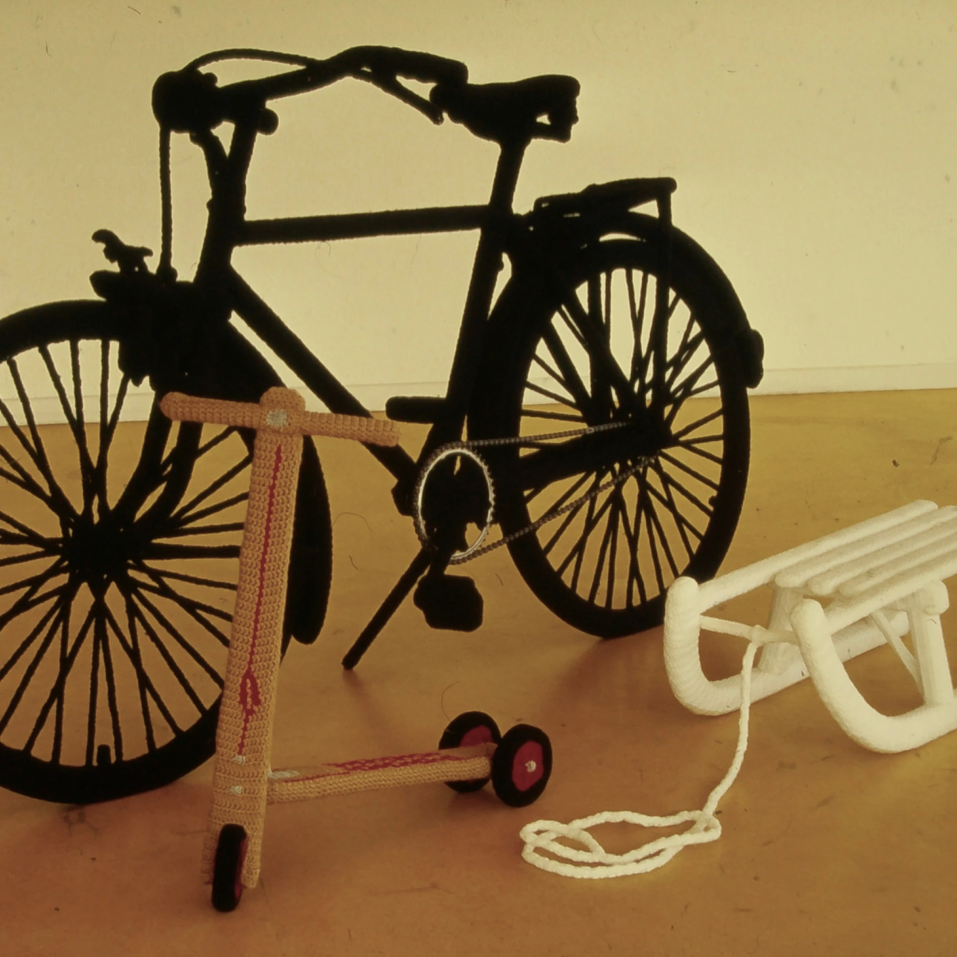 *Häkelarbeiten: Fahrrad, Schlitten, Roller*, 2000, bicycle (180 x 60 x 110 cm), sledge (82 x 35 x 22 cm), scooter (60 x 70 x 30 cm), acrylic yarn