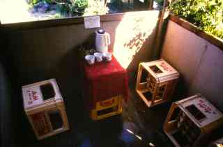 *Hochsitz innen*, 1999, 180 x 180 x 200 cm, acorns, beer crates, thermos flask, mug